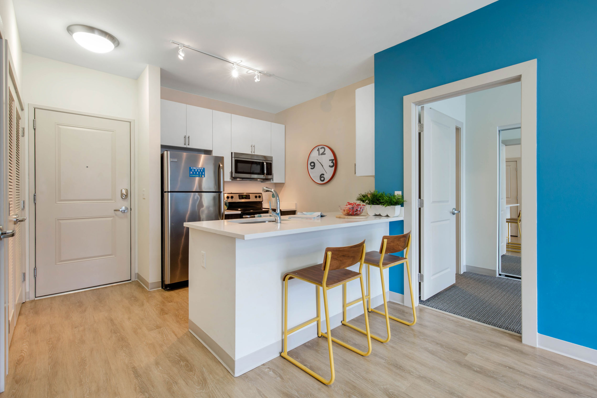 Kitchen at Landmark College Park, featuring stainless steel appliances and quartz countertops.