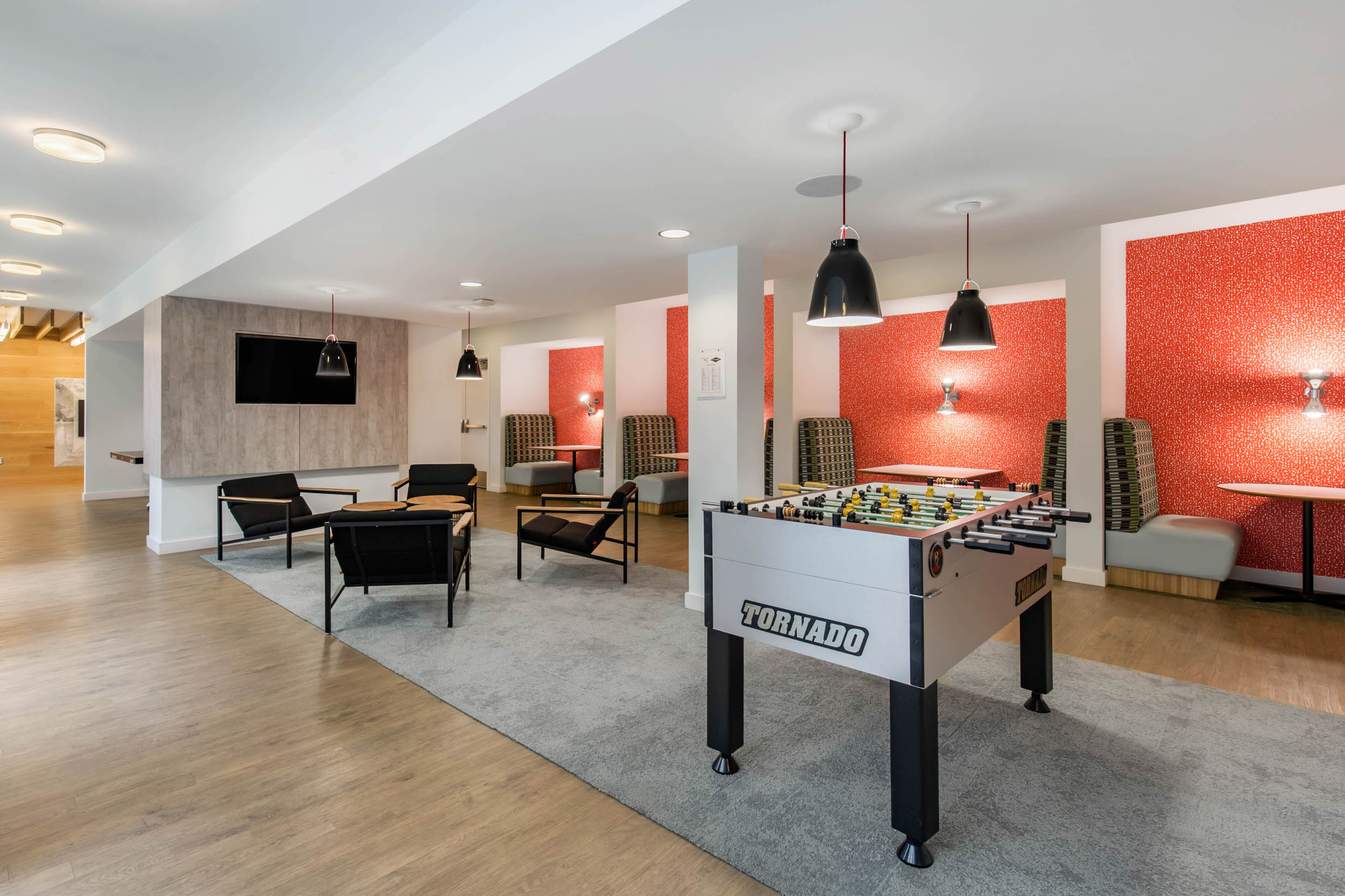 The club room is the perfect space to kick back and watch the game or catch up with friends.