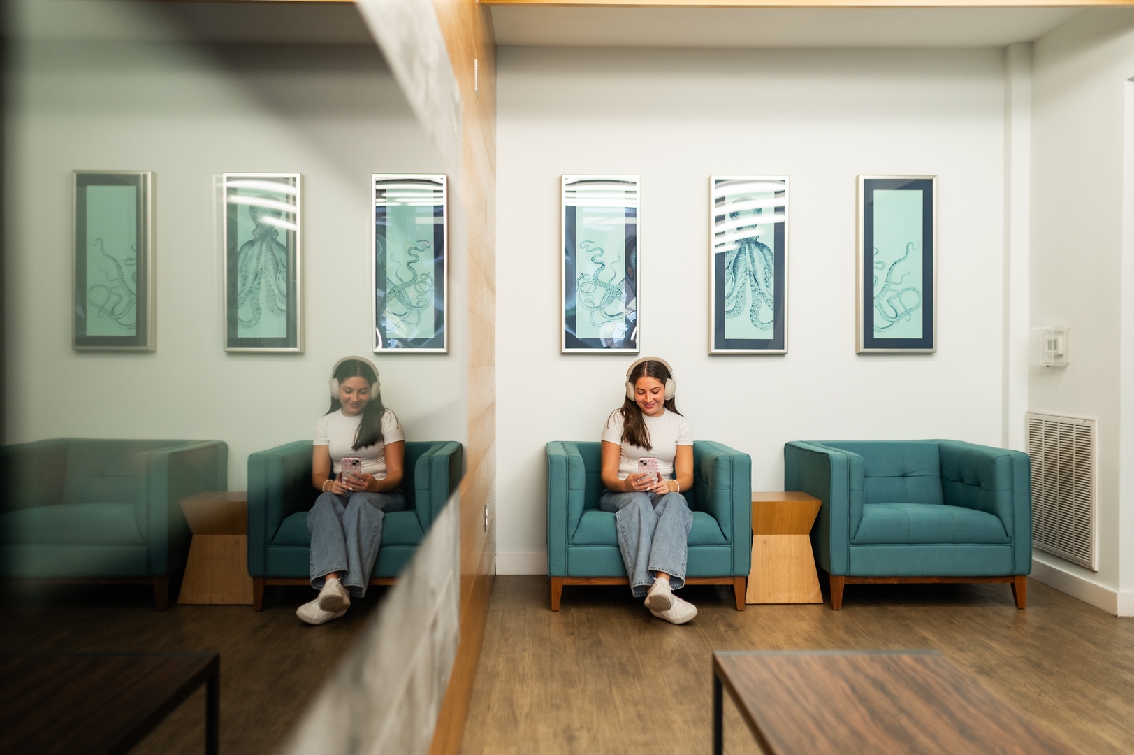 one girl sitting relaxing headphones on at landmark college park