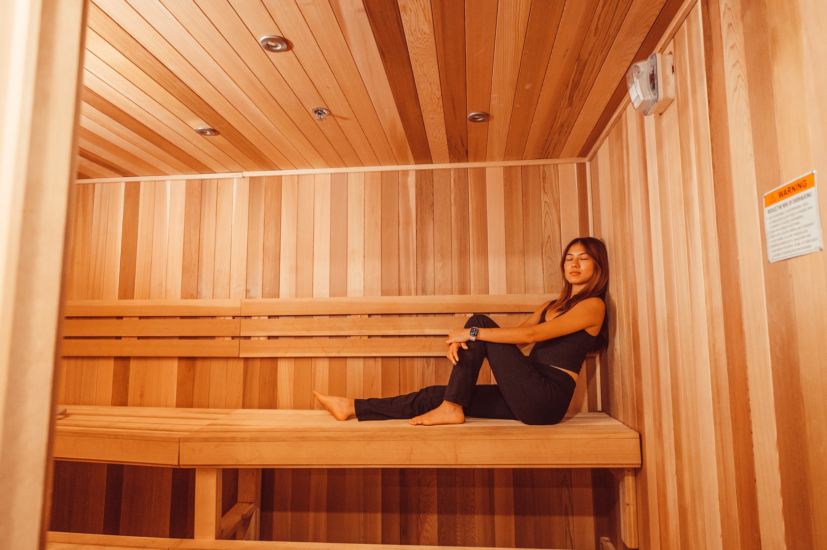 one girl sitting and relaxing in sauna at landmark college park