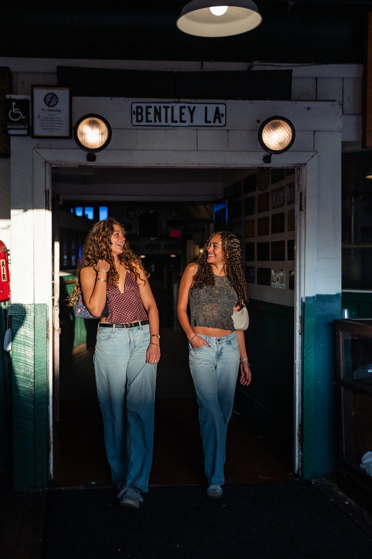 two girls talking and walking while staring at each other at landmark college park