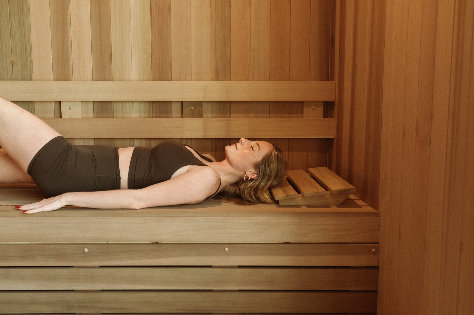 one girl lying down in sauna at landmark college park
