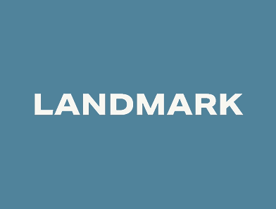 The image has a blue-gray background with the word “LANDMARK” written in bold, white uppercase letters centered in the middle.